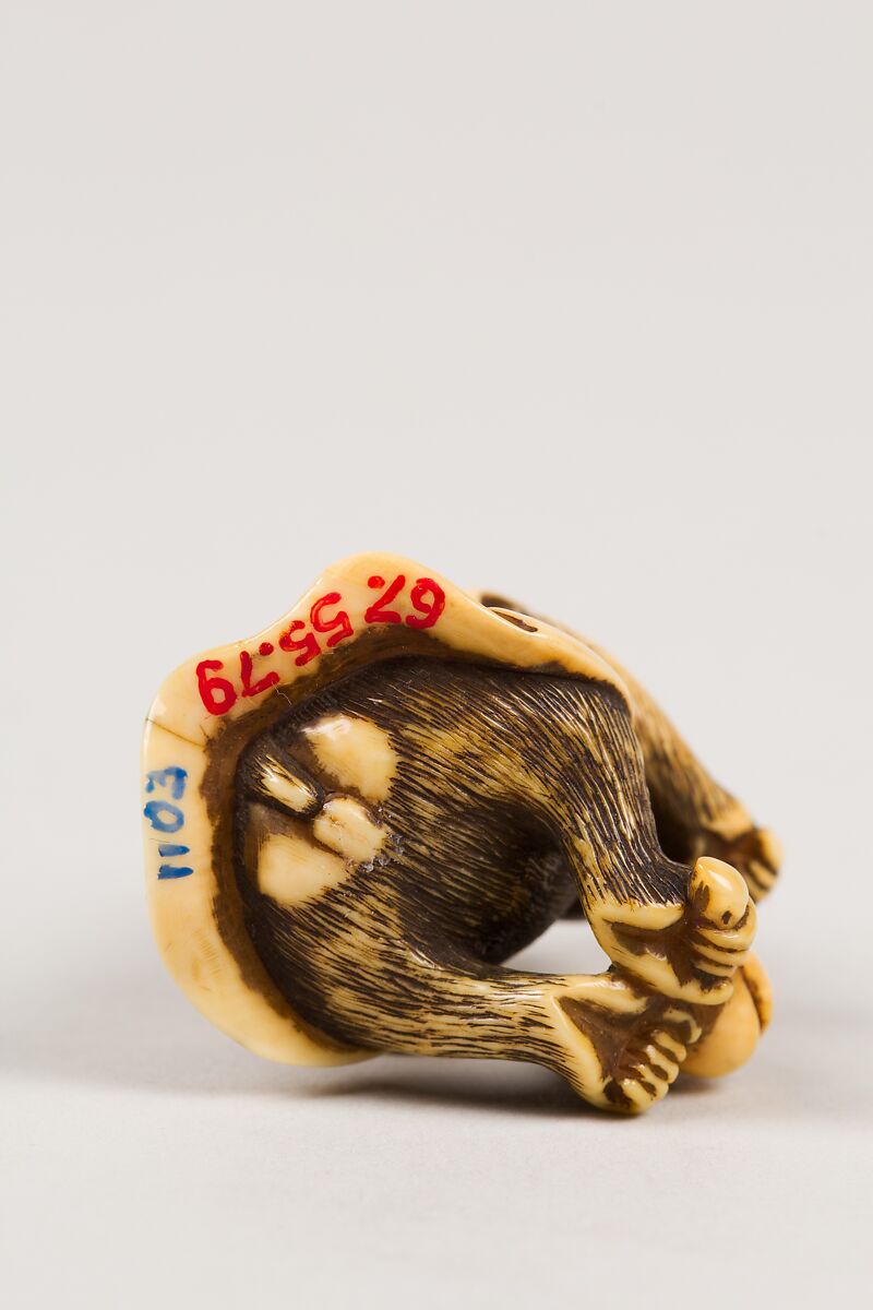 Netsuke in the Shape of a Monkey with a Peach, Ivory, Japan