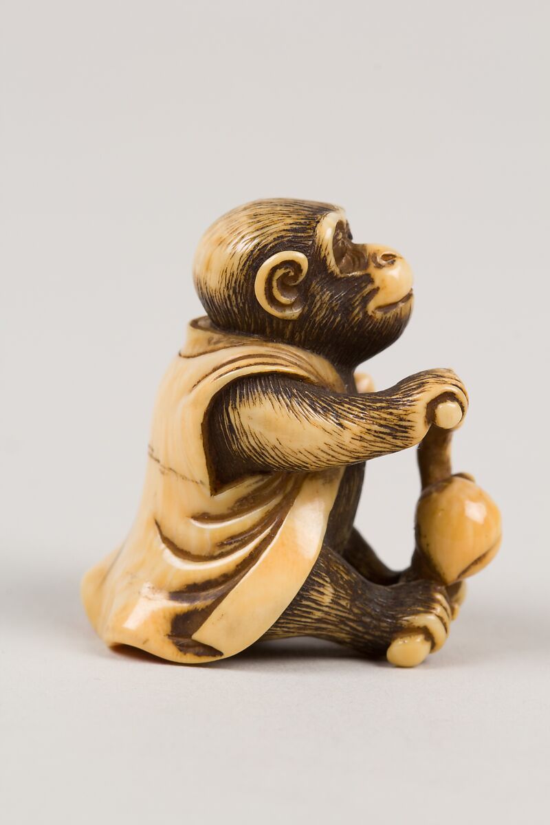Netsuke in the Shape of a Monkey with a Peach, Ivory, Japan