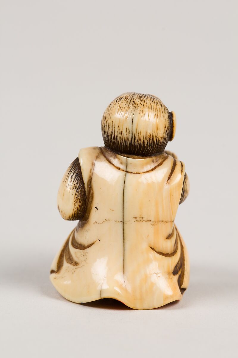 Netsuke in the Shape of a Monkey with a Peach, Ivory, Japan