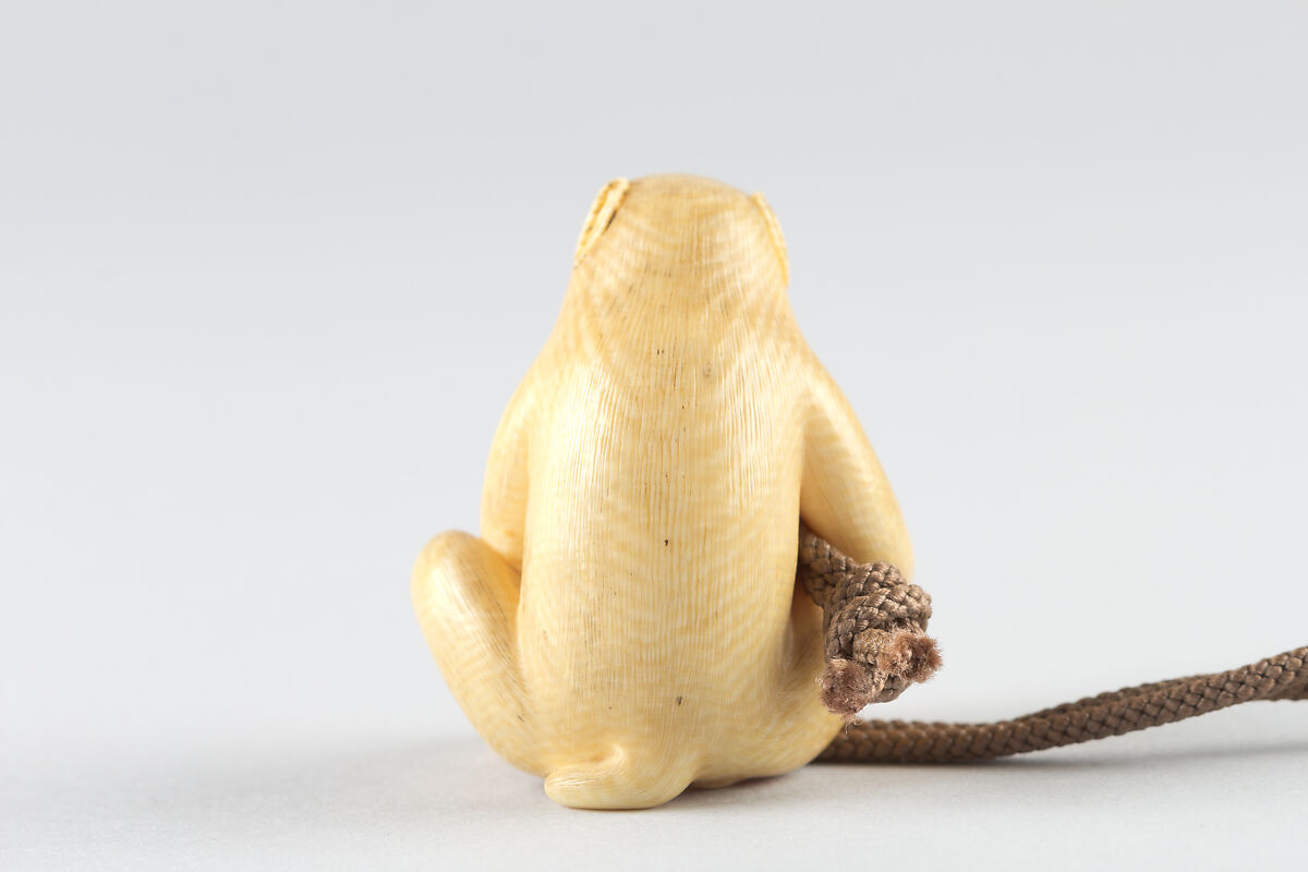 Netsuke of Seated Monkey with Persimmon, Ivory, Japan