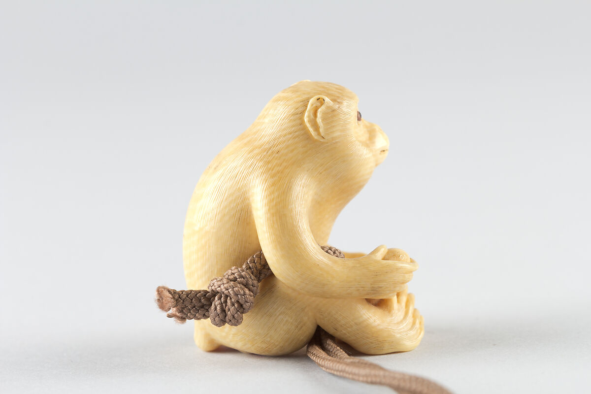 Netsuke of Seated Monkey with Persimmon, Ivory, Japan