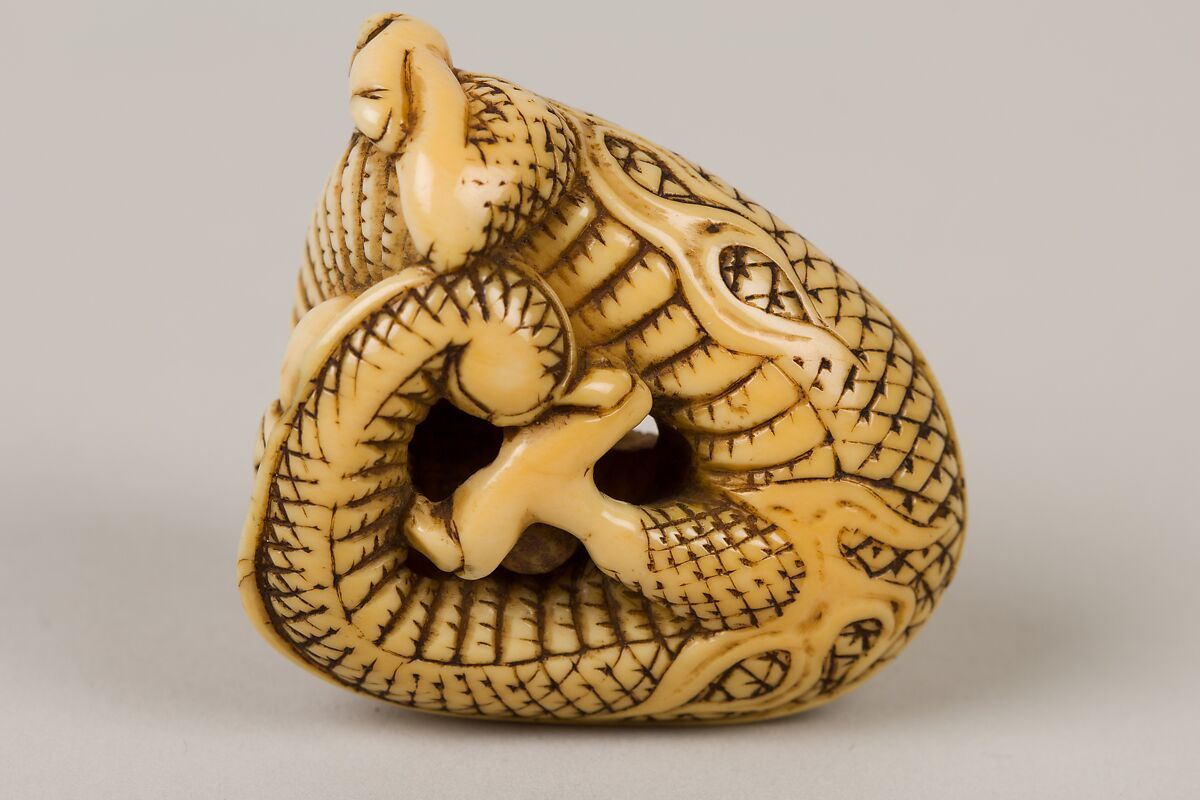 Netsuke of Coiled Dragon Enclosing a Pearl, Ivory, Japan