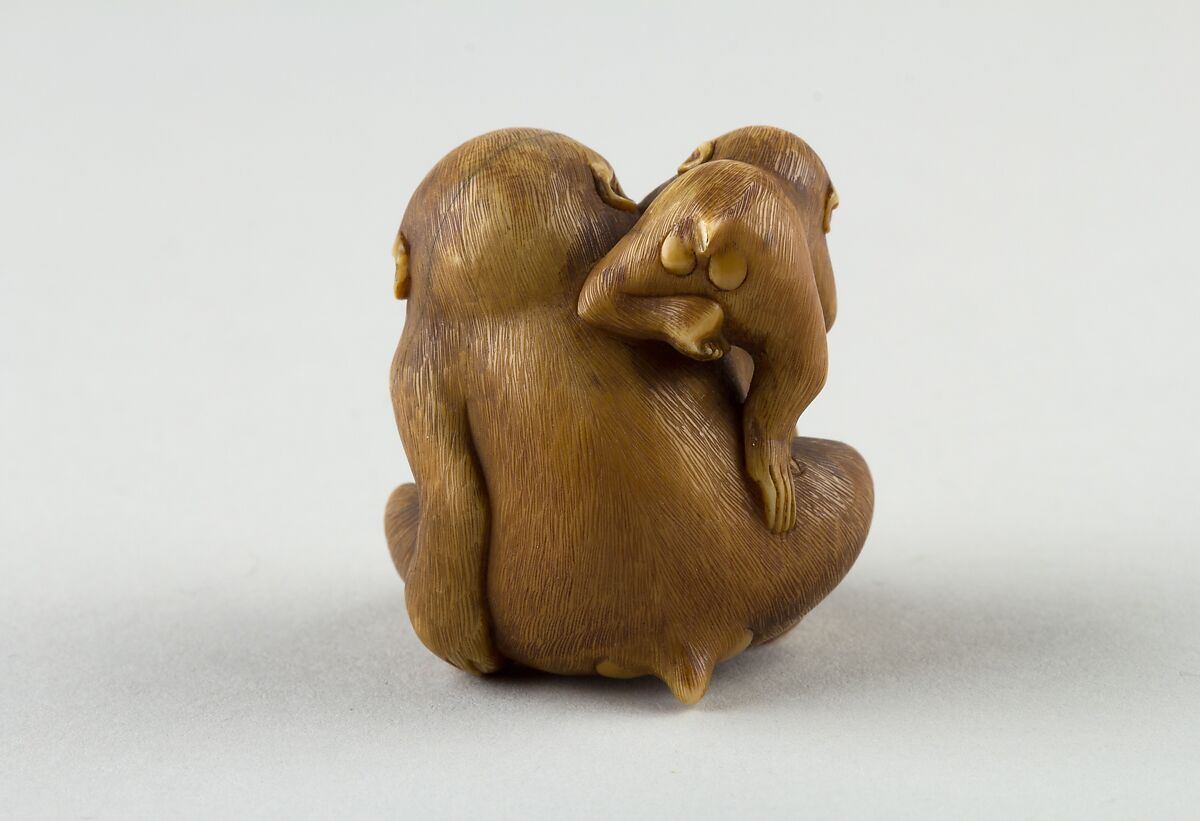 Netsuke of a Female Monkey Holding a Nut while her Baby Crawls on her Back, Masatami, Ivory, horn, Japan