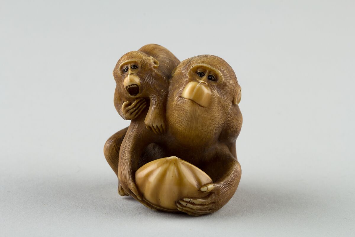 Netsuke of a Female Monkey Holding a Nut while her Baby Crawls on her Back, Masatami, Ivory, horn, Japan 