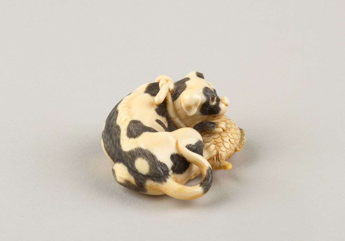 Netsuke of a Dog and a Fish, Ivory, horn, Japan