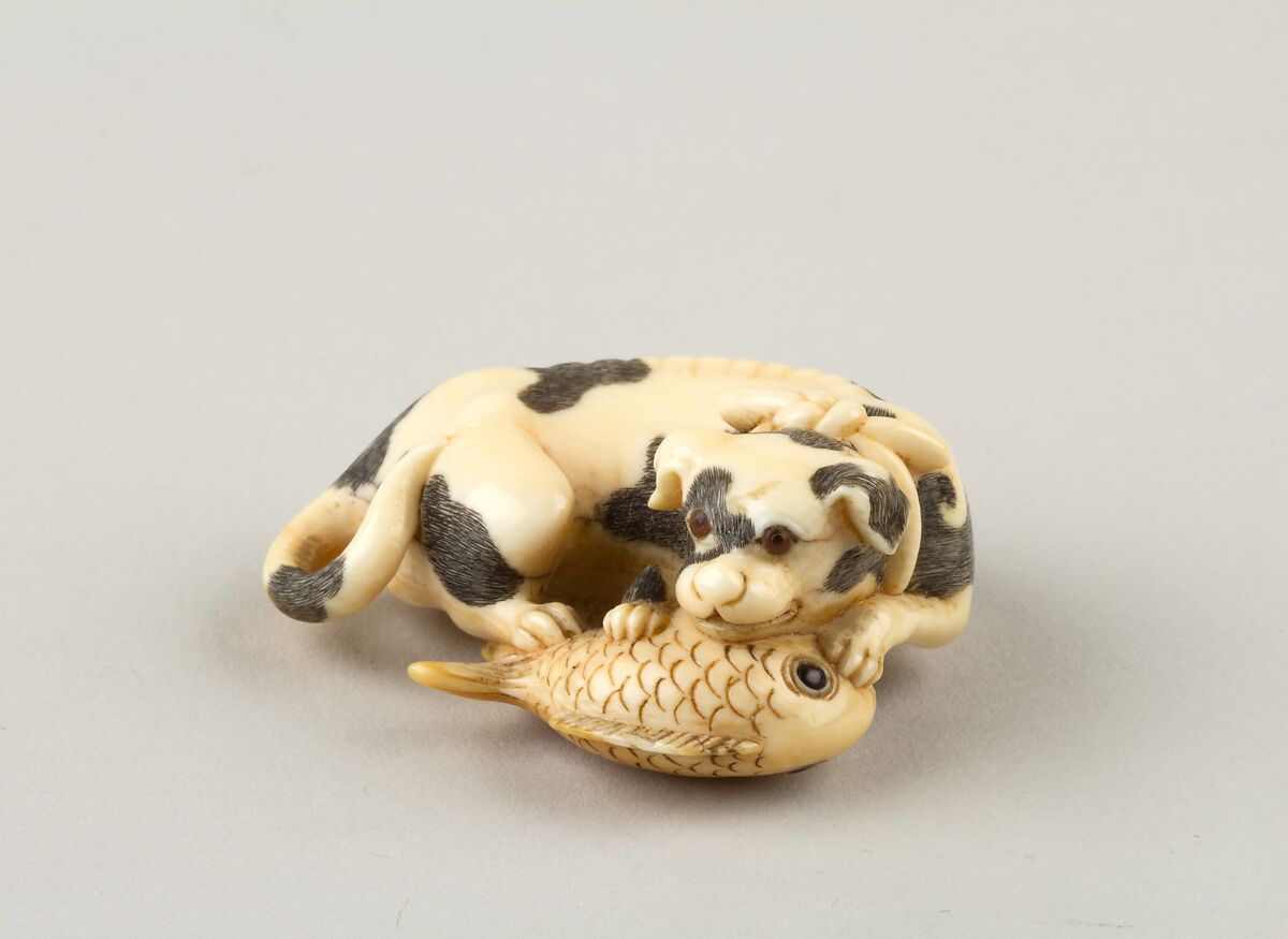 Netsuke of a Dog and a Fish, Ivory, horn, Japan 