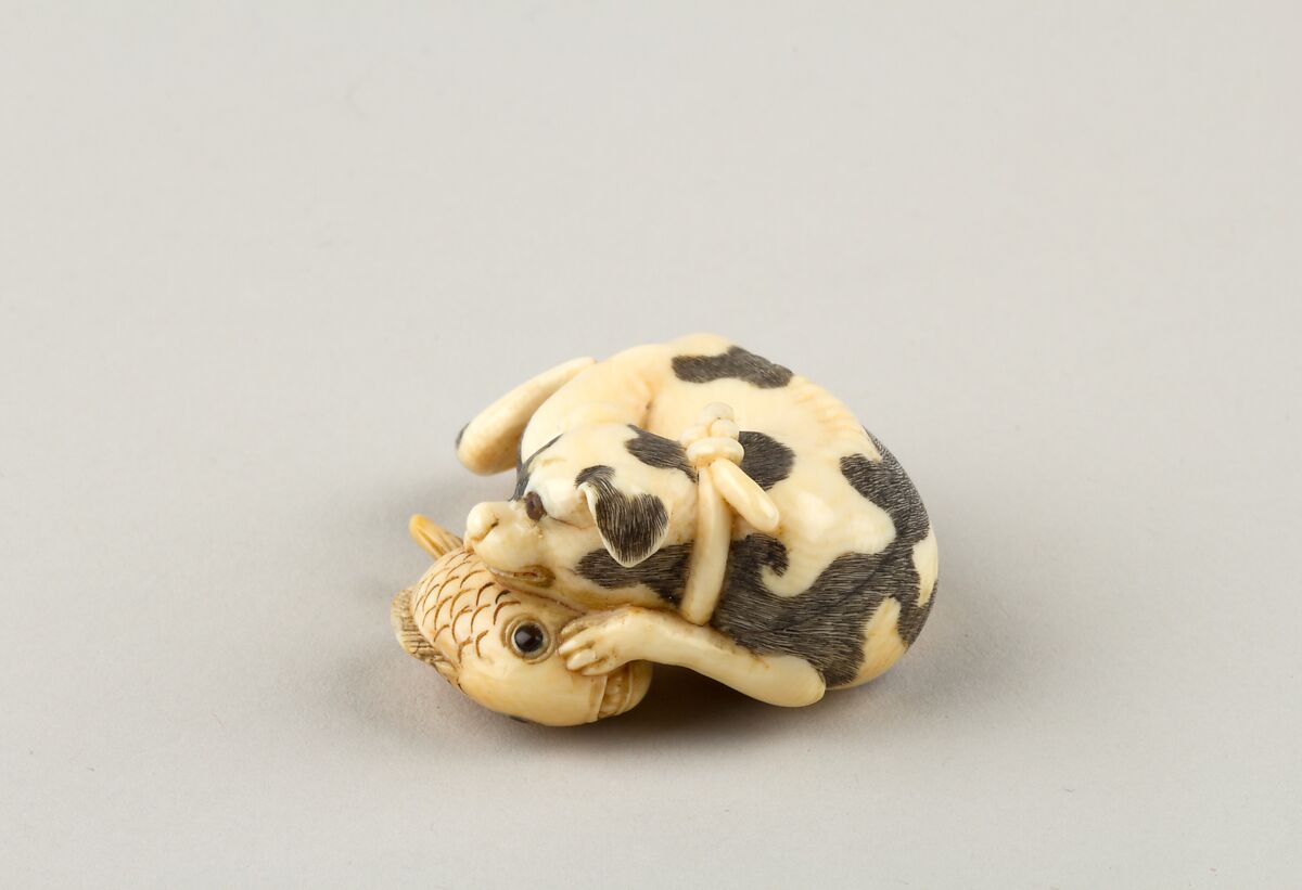 Netsuke of a Dog and a Fish, Ivory, horn, Japan