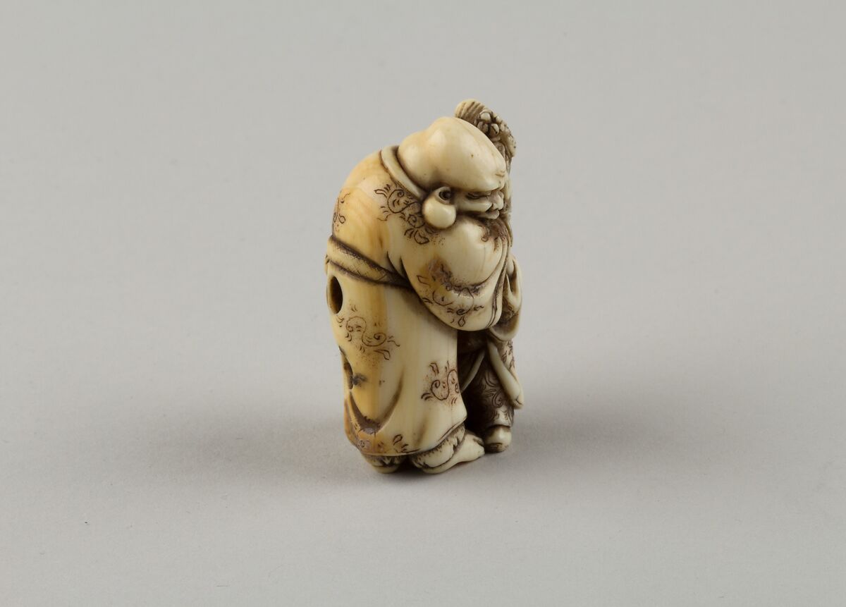 Netsuke of Man and Two Children with a Sambaso Dancer Puppet, Masahide, Ivory, Japan