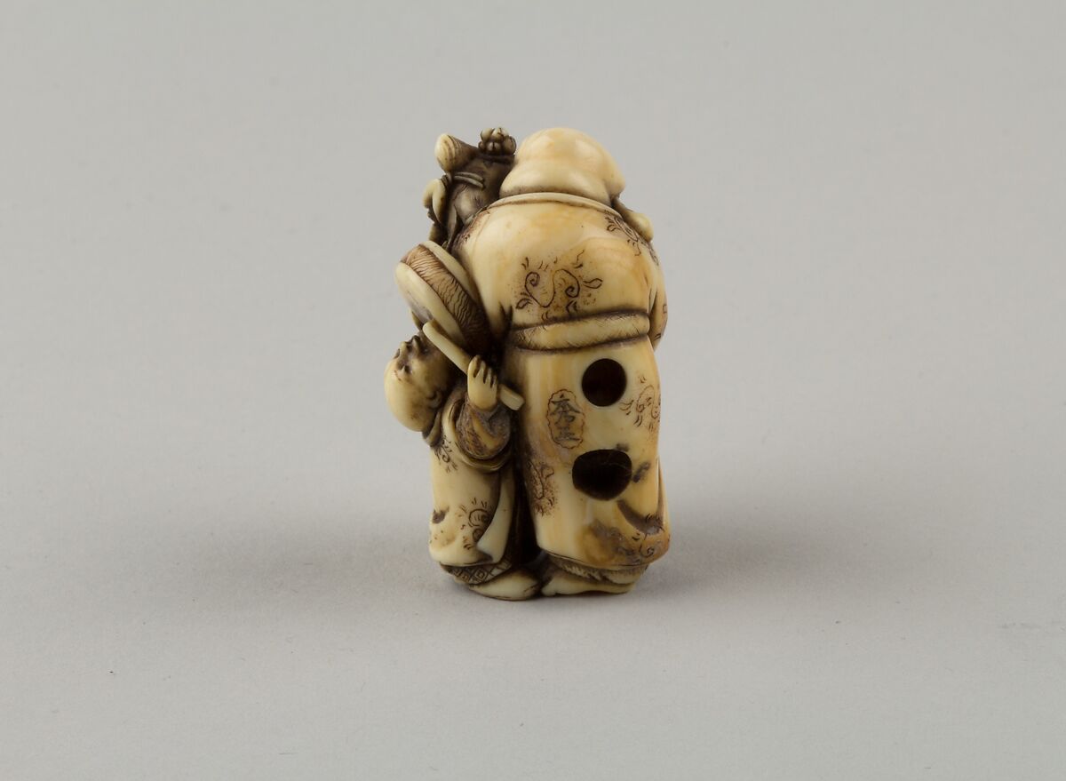 Netsuke of Man and Two Children with a Sambaso Dancer Puppet, Masahide, Ivory, Japan