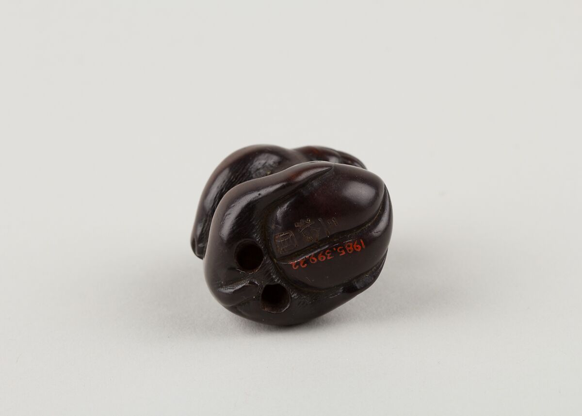 Netsuke of Monkey with One Hand over Mouth, the Other Behind His Back, Miwa, Ebony, ivory inlay, Japan