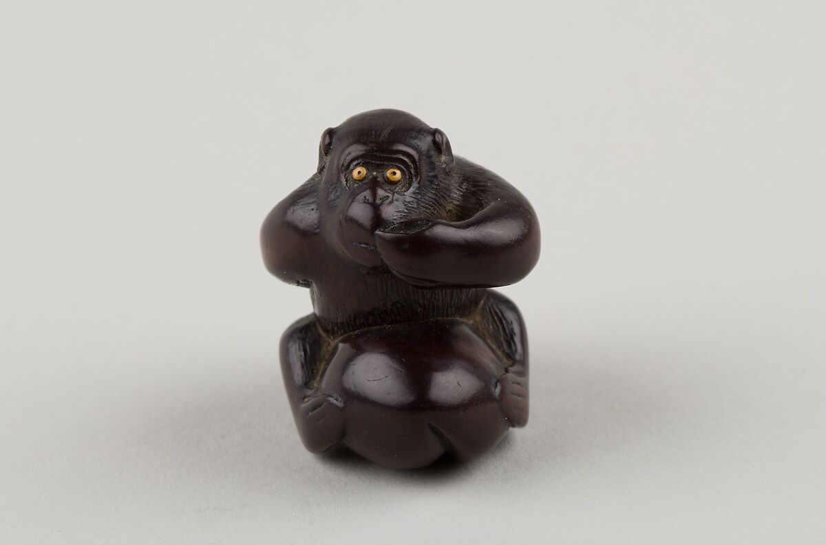 Netsuke of Monkey with One Hand over Mouth, the Other Behind His Back, Miwa, Ebony, ivory inlay, Japan