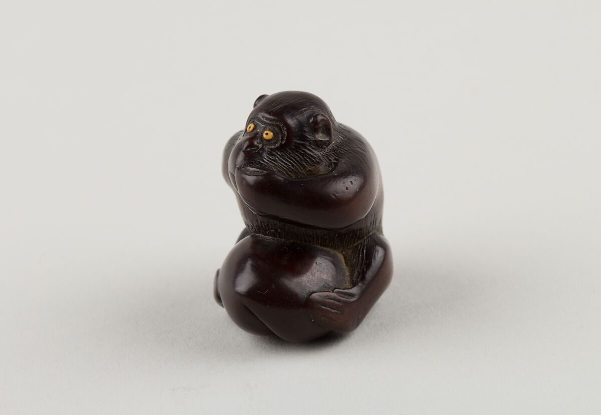 Netsuke of Monkey with One Hand over Mouth, the Other Behind His Back, Miwa, Ebony, ivory inlay, Japan