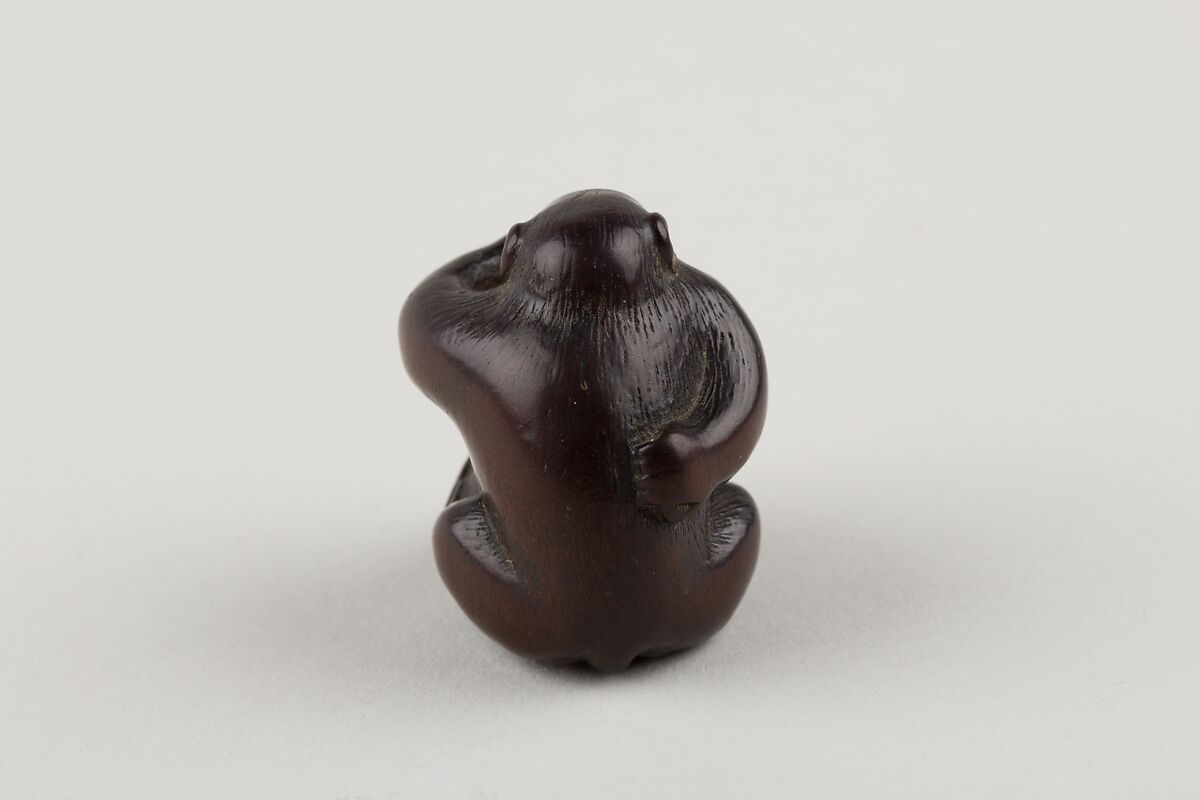 Netsuke of Monkey with One Hand over Mouth, the Other Behind His Back, Miwa, Ebony, ivory inlay, Japan