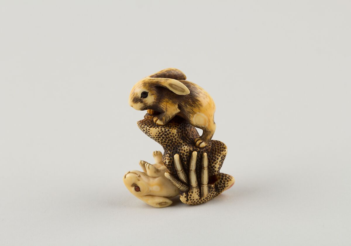 Netsuke of Two Rabbits and a Rock, Mitsuharu, Ivory; coral and horn inlay, Japan 
