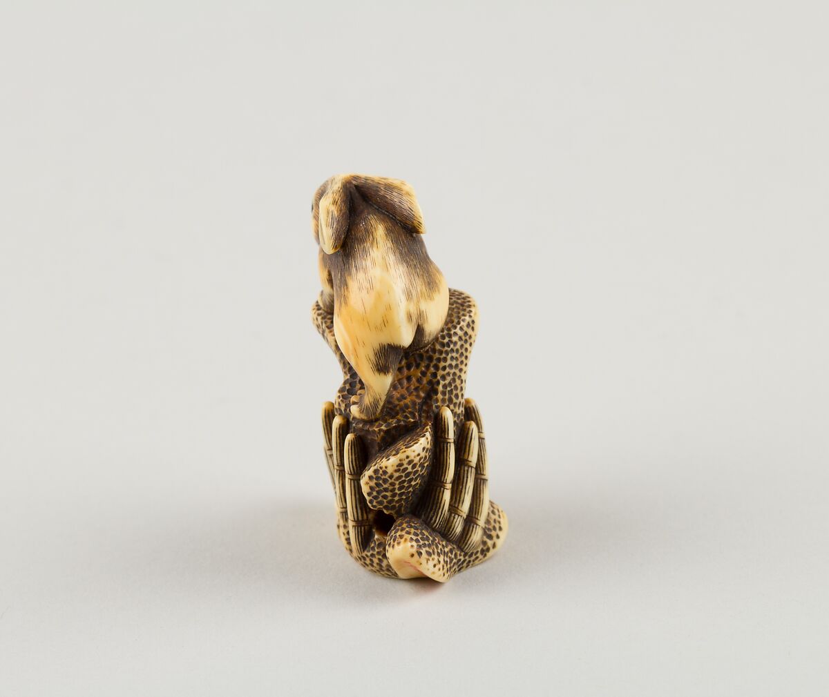 Netsuke of Two Rabbits and a Rock, Mitsuharu, Ivory; coral and horn inlay, Japan