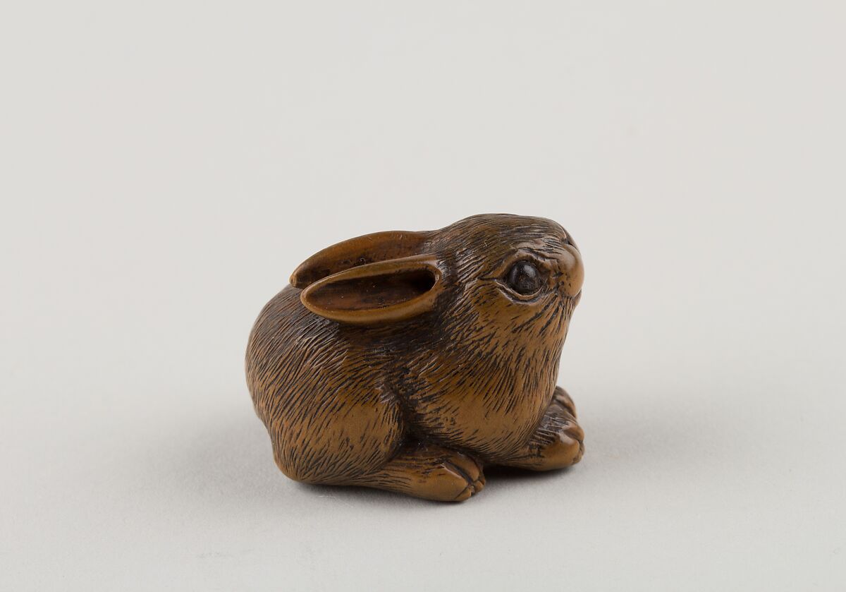 Netsuke of a Seated Hare, Minkō (Japanese, ca. 1735–1816), Wood, horn, Japan