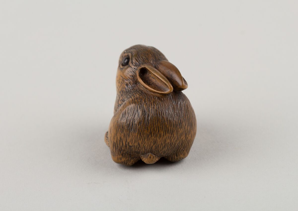 Netsuke of a Seated Hare, Minkō (Japanese, ca. 1735–1816), Wood, horn, Japan