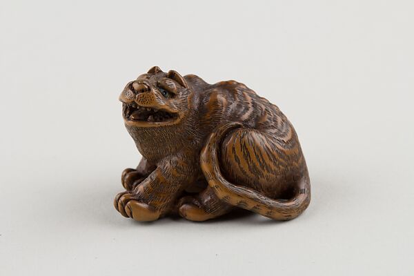 Netsuke of Seated Tiger with Tail Curled beside Him