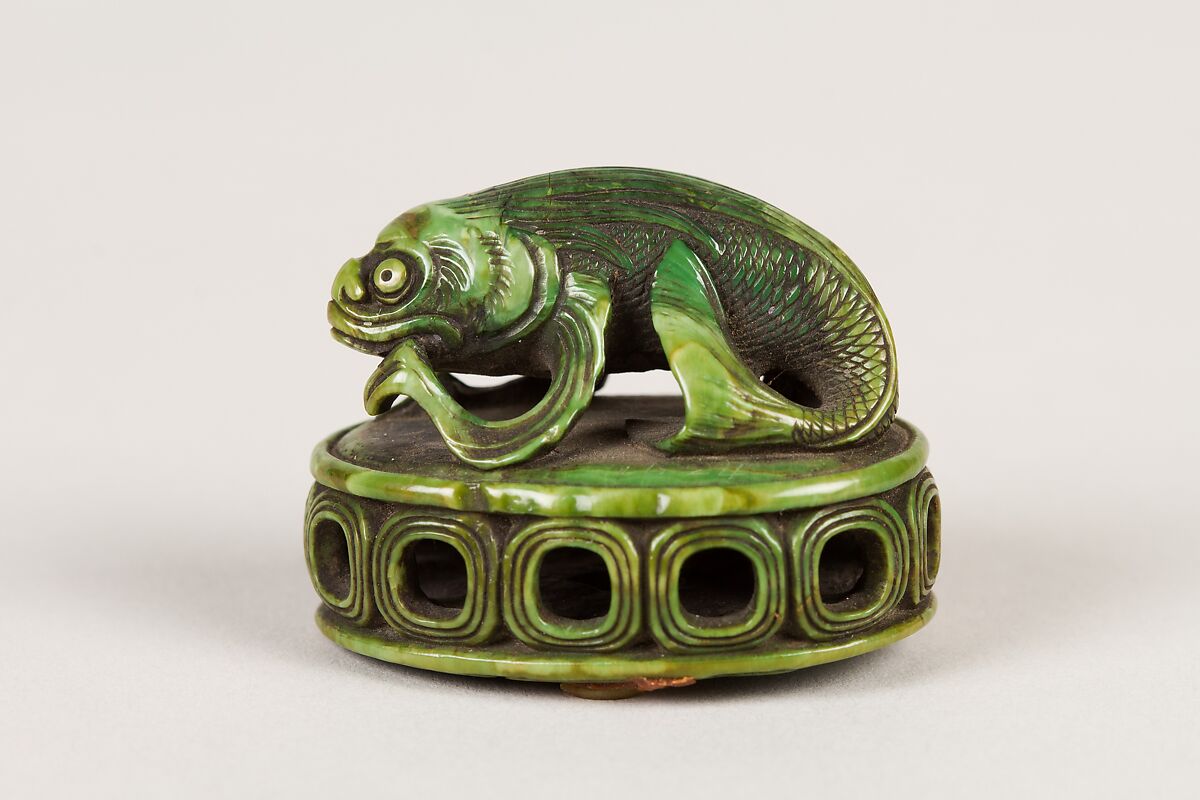 Netsuke of Fish on a Seal, Ivory stained green, Japan 