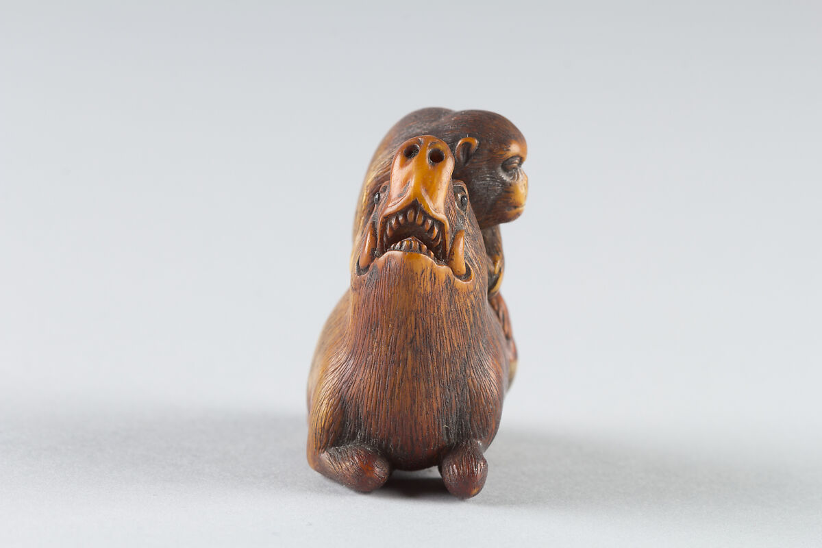 Netsuke of Monkey Attacking a Boar, Ivory-stained brown, Japan