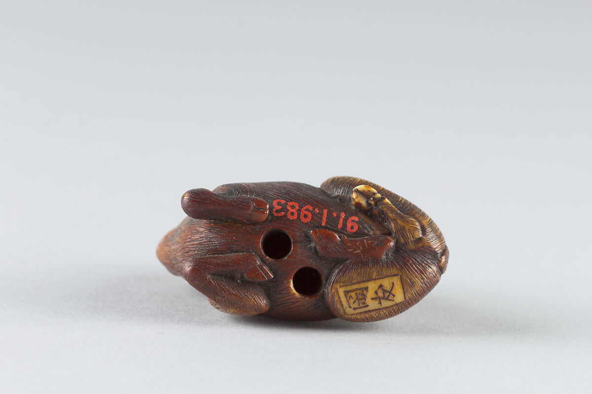 Netsuke of Monkey Attacking a Boar, Ivory-stained brown, Japan