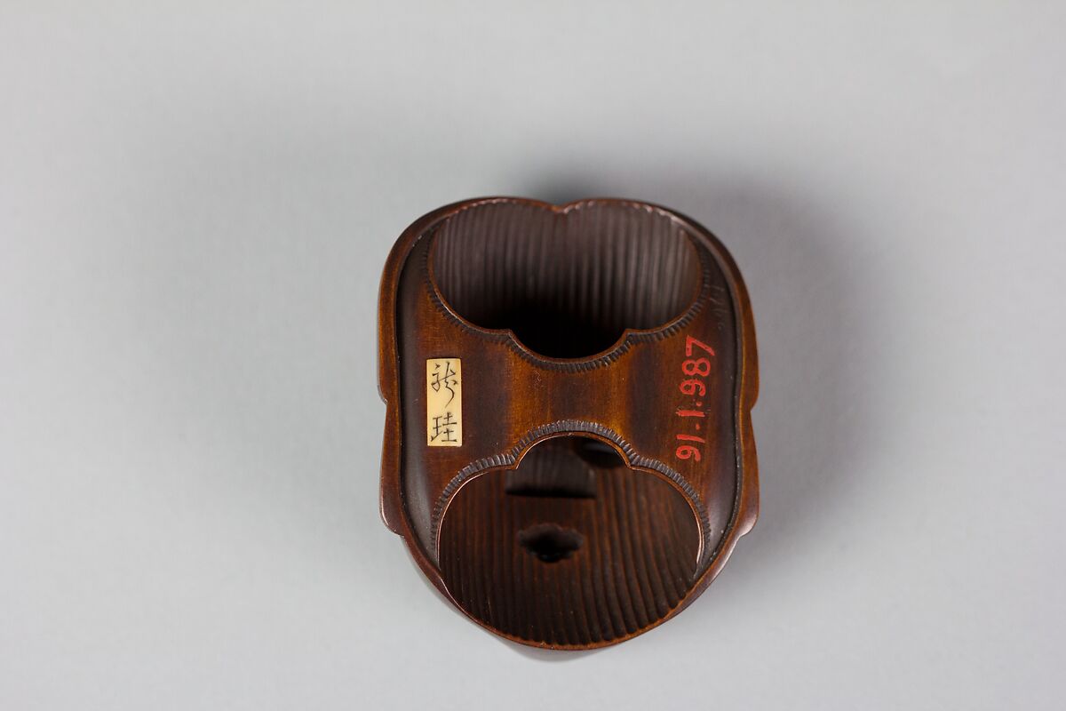 Netsuke of Noh mask; Face of Usume, Wood, Japan