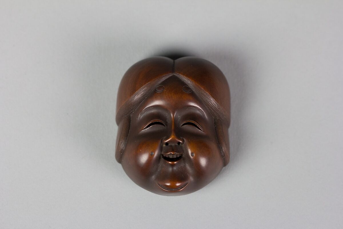 Netsuke of Noh mask; Face of Usume, Wood, Japan 