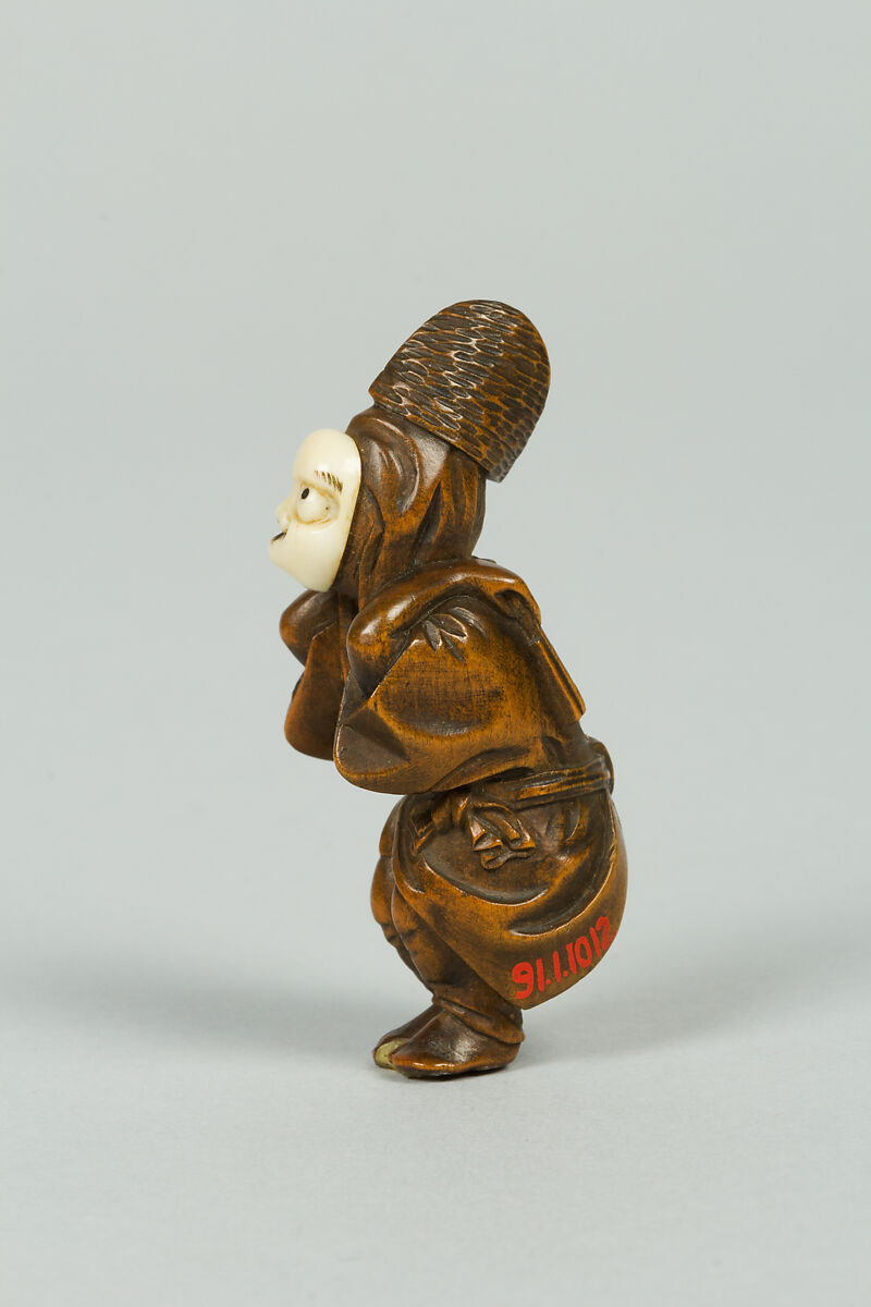 Netsuke of Boy Wearing an Ivory Mask, Wood, ivory, Japan