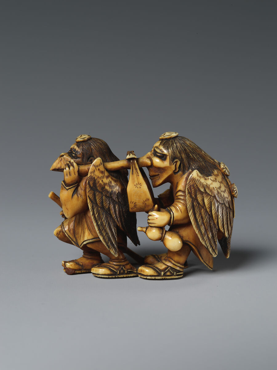 Two Mythical Creatures (Tengu) Carrying a Parcel, Ivory, Japan