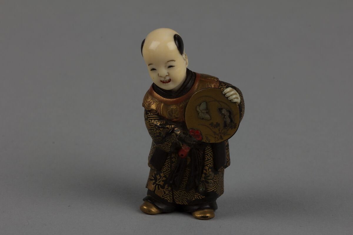 Netsuke of Boy with a Fan, Lacquered; head of ivory, Japan 