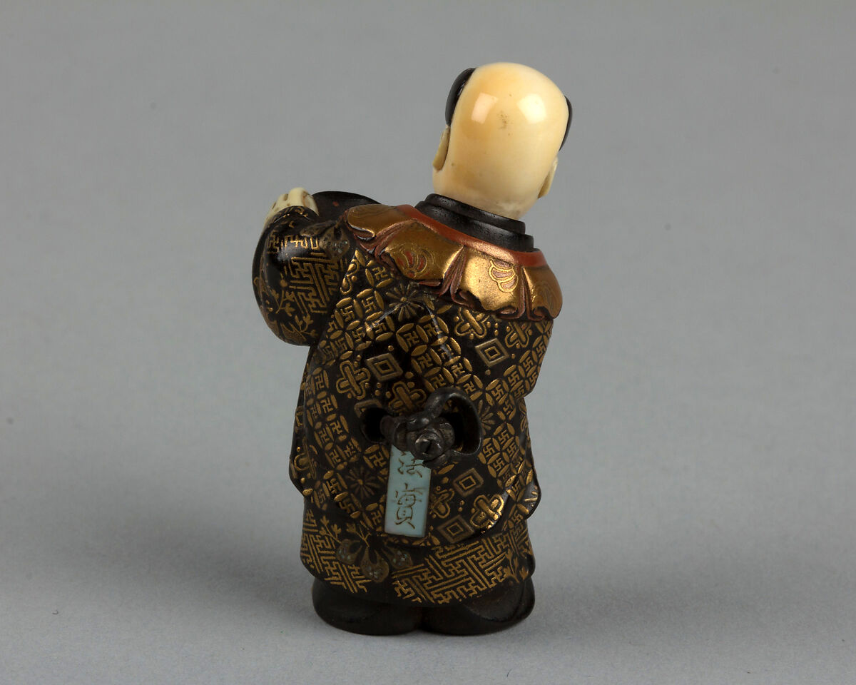 Netsuke of Boy with a Fan, Lacquered; head of ivory, Japan