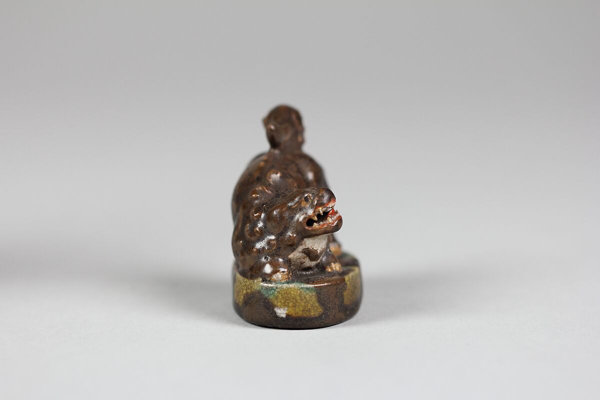 Netsuke, Porcelaneous ware with a finely crackled glaze and an overglaze, Japan