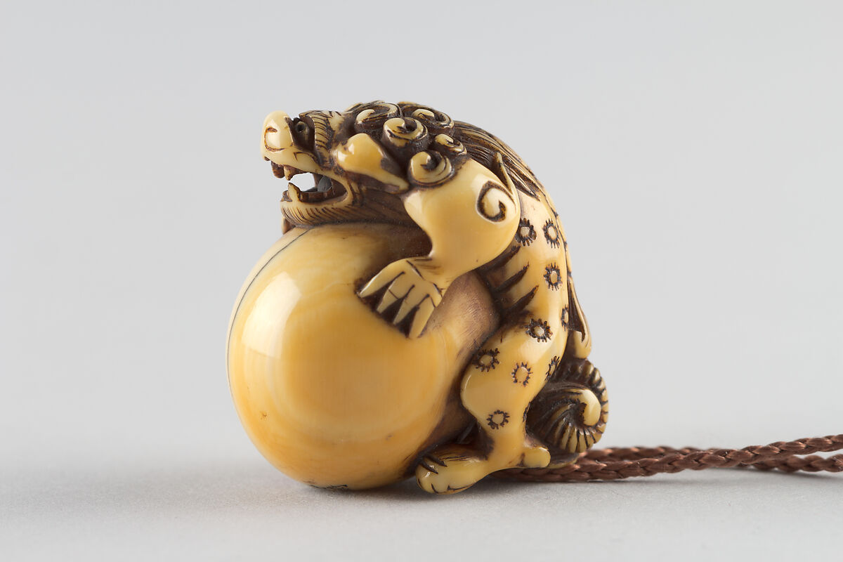 Netsuke in the Shape of a Lion with a Ball, Ivory, Japan 