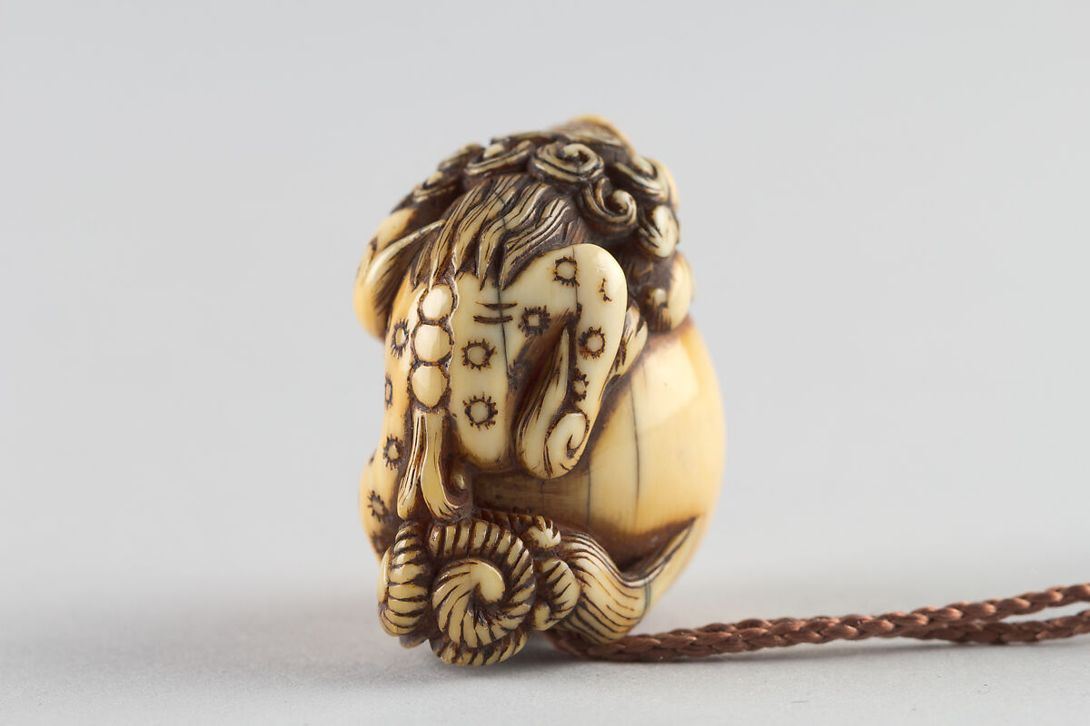 Netsuke in the Shape of a Lion with a Ball, Ivory, Japan