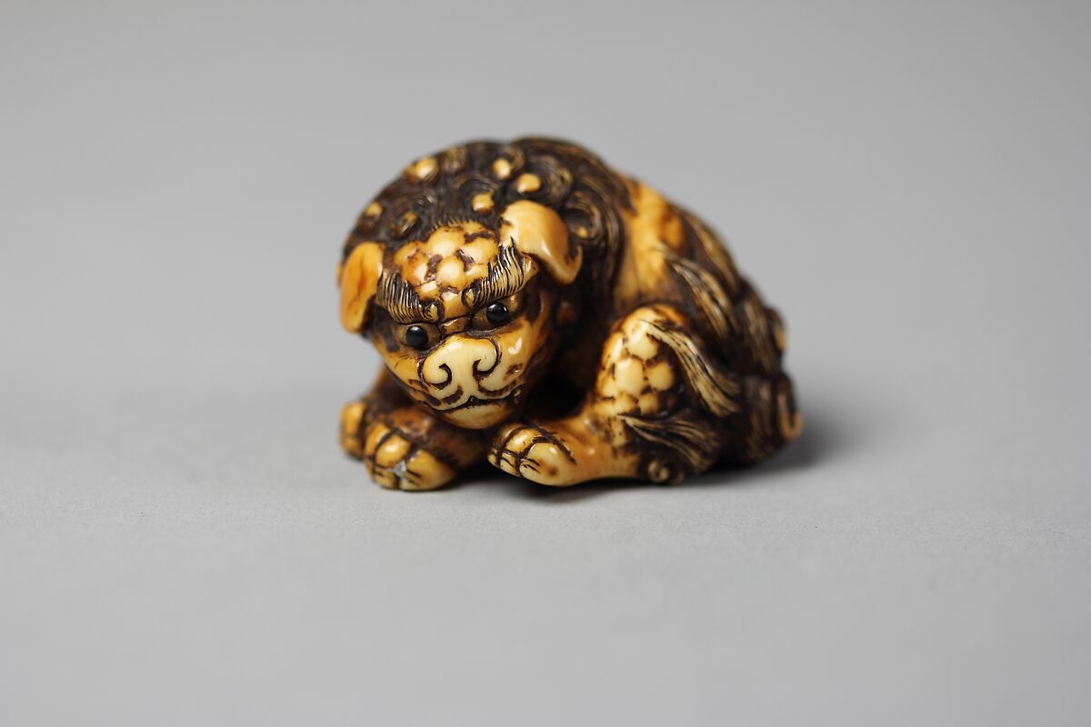 Netsuke of a Karashishi, Ivory and gold, Japan