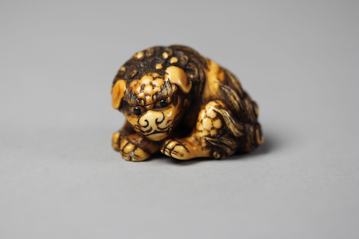 Netsuke of a Karashishi, Ivory and gold, Japan 