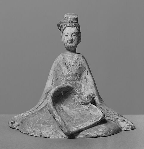 Female attendant with dustpan