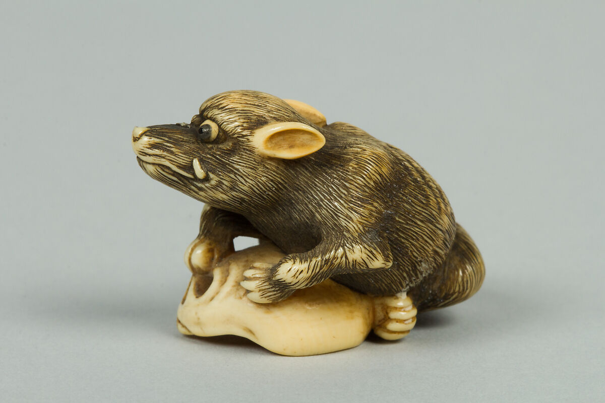Netsuke of Boar with a Human Skull, Ivory, Japan