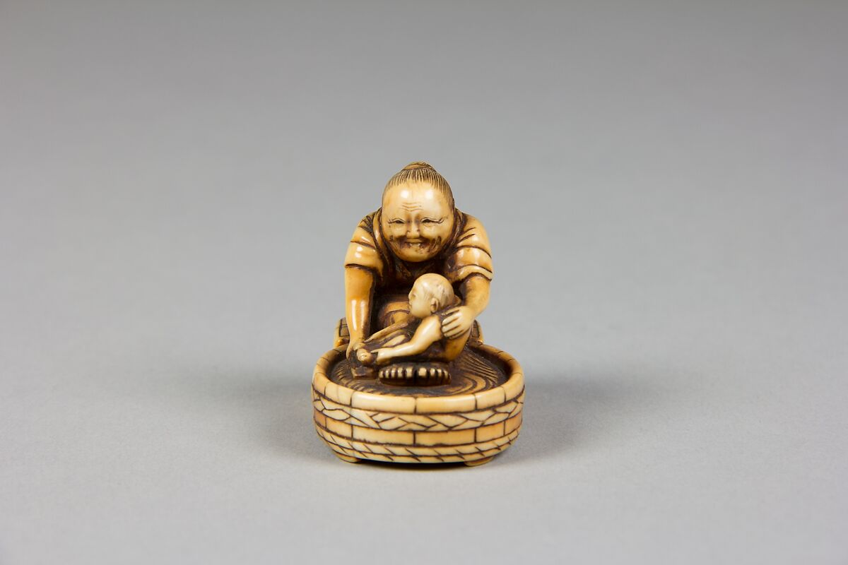 Netsuke of Old Woman Bathing Child in a Tub, Ivory, Japan