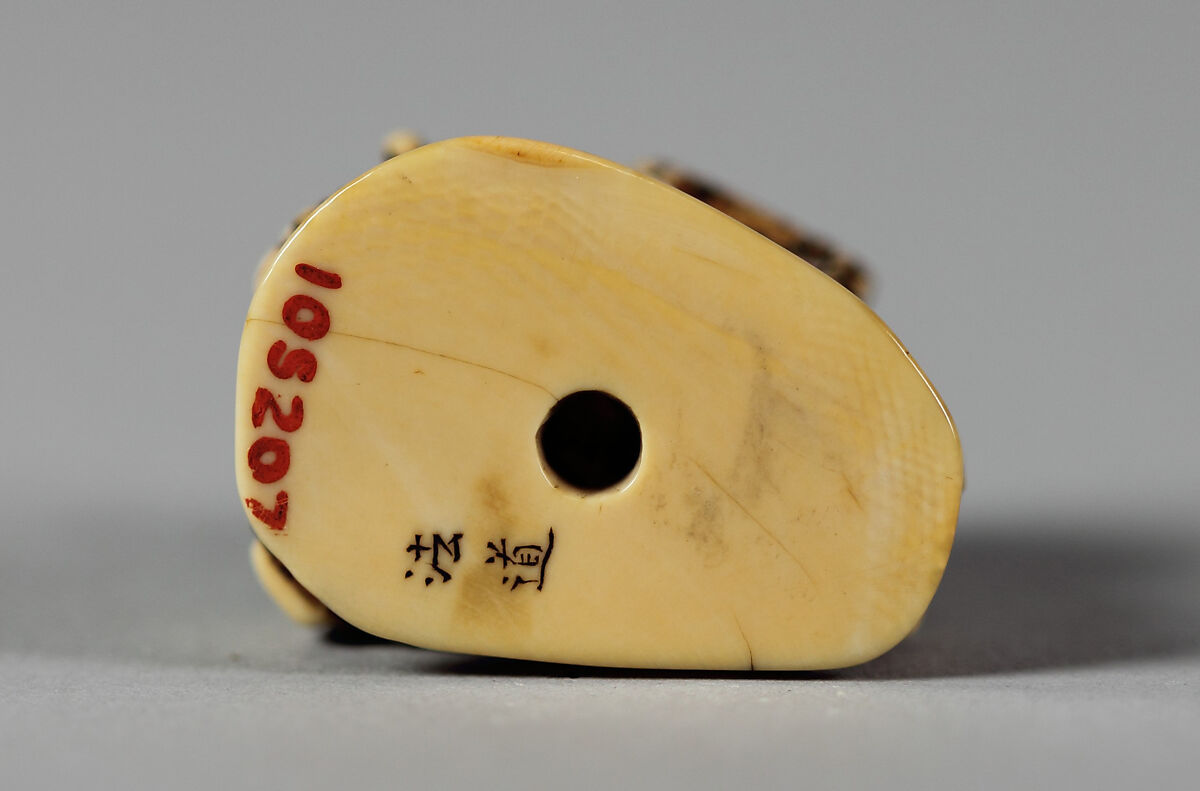 Netsuke of Man Leading an Ox with Bundles of Wood on its Back, Ivory, Japan