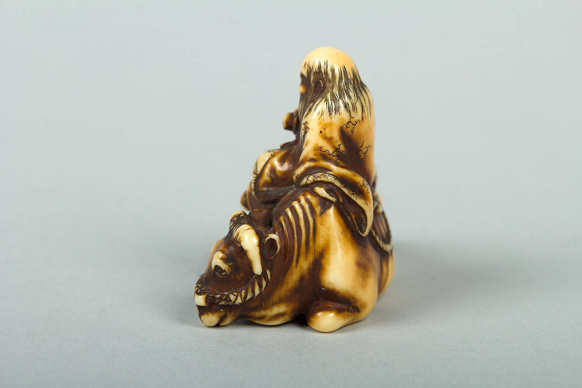 Netsuke of Man Sitting on a Recumbent Ox, Ivory, Japan