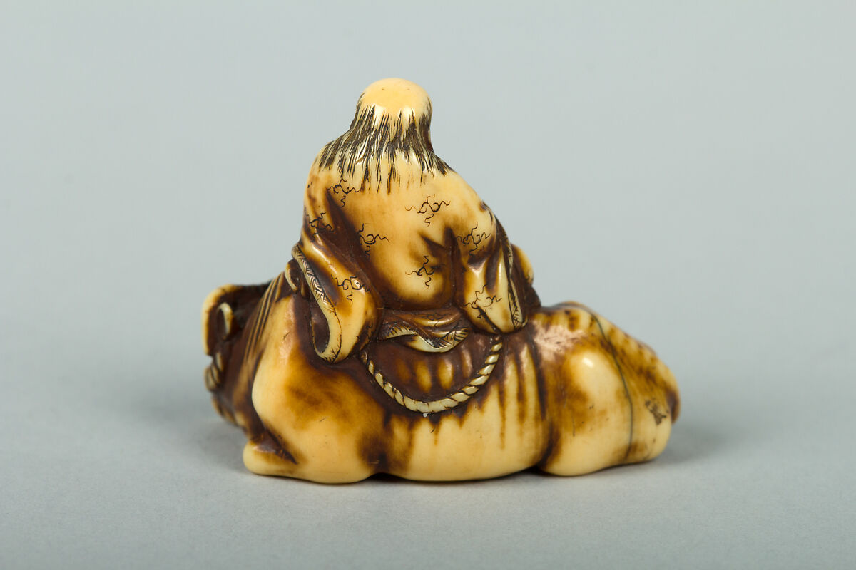 Netsuke of Man Sitting on a Recumbent Ox, Ivory, Japan