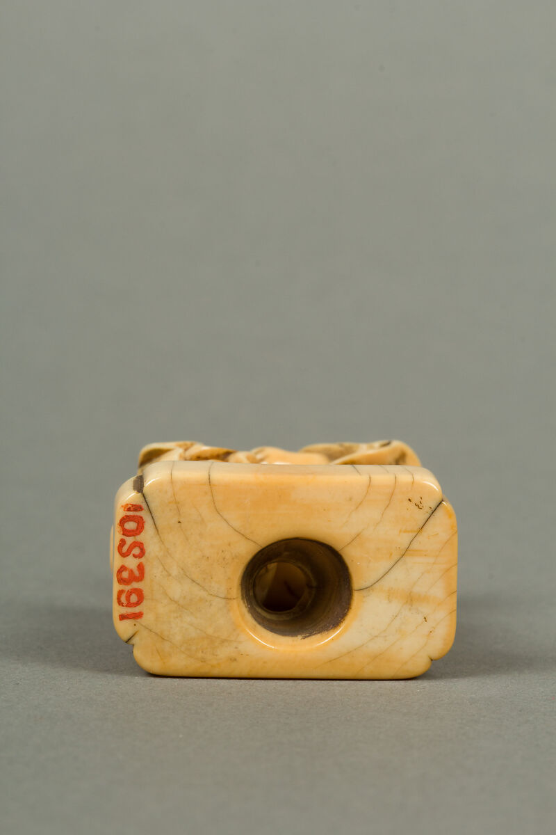 Netsuke of Man with a Bag, Standing on a Block, Ivory, Japan