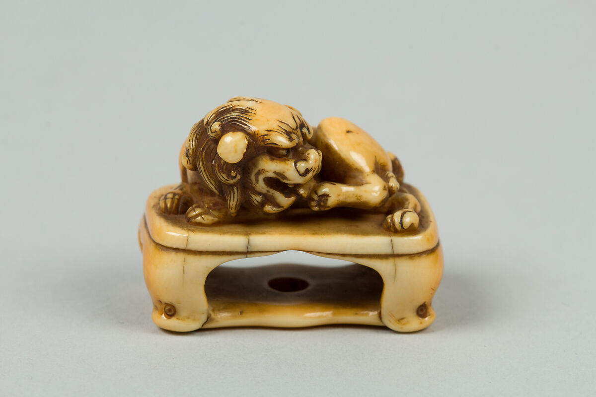 Netsuke of Lion on a Stand, Ivory, Japan 