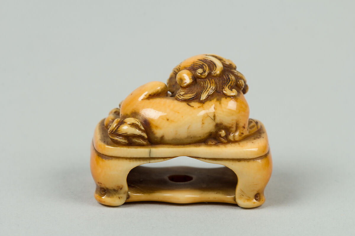 Netsuke of Lion on a Stand, Ivory, Japan