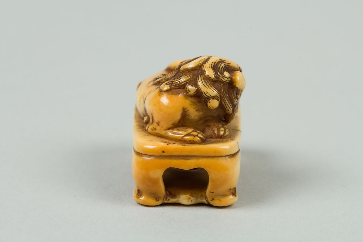 Netsuke of Lion on a Stand, Ivory, Japan