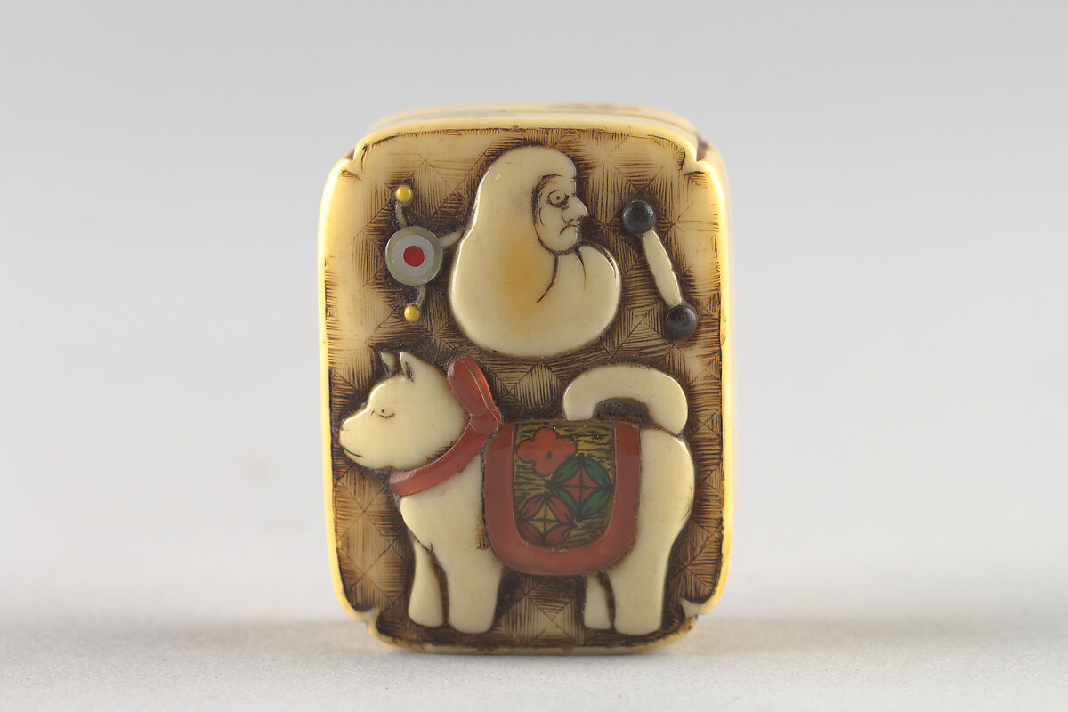 Netsuke of Box with Children's Toys, Ivory; inlaid; Hako style, Japan 