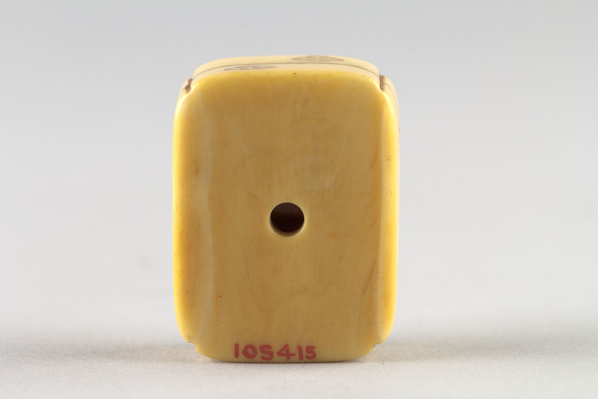 Netsuke of Box with Children's Toys, Ivory; inlaid; Hako style, Japan