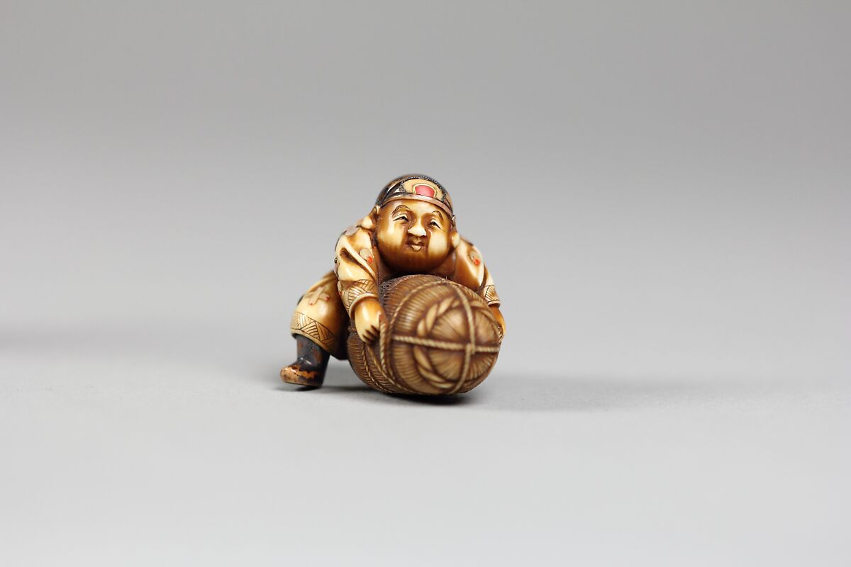 Netsuke, Ivory inlaid with mother-of-pearl and coral, Japan 