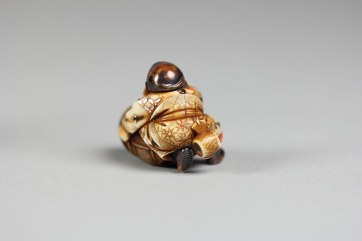 Netsuke, Ivory inlaid with mother-of-pearl and coral, Japan